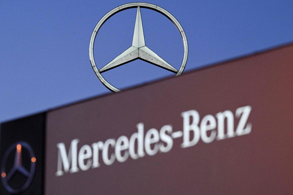 GERMANY-ECONOMY-TRANSPORT-AUTOMOBILE-MERCEDES-BENZ-EARNINGS
A giant logo of German automotive brand Mercedes-Benz is seen atop a Mercedes dealership in Offenbach, western Germany, on April 29, 2026. (Photo by Kirill KUDRYAVTSEV / AFP)