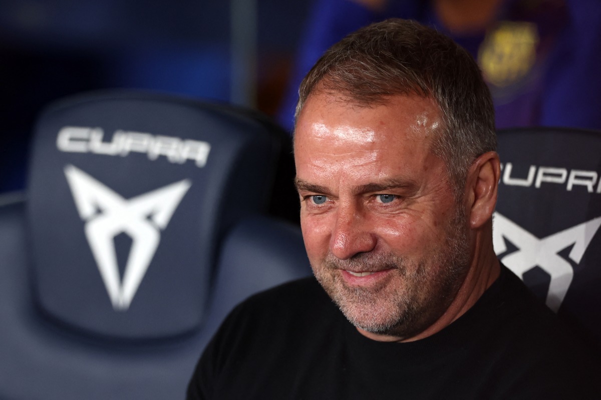 Barcelona's German coach Hans-Dieter Flick smiles before the Spanish league football match between FC Barcelona and RC Celta de Vigo at Camp Nou stadium in Barcelona on April 22 , 2026. (Photo by Josep LAGO / AFP
