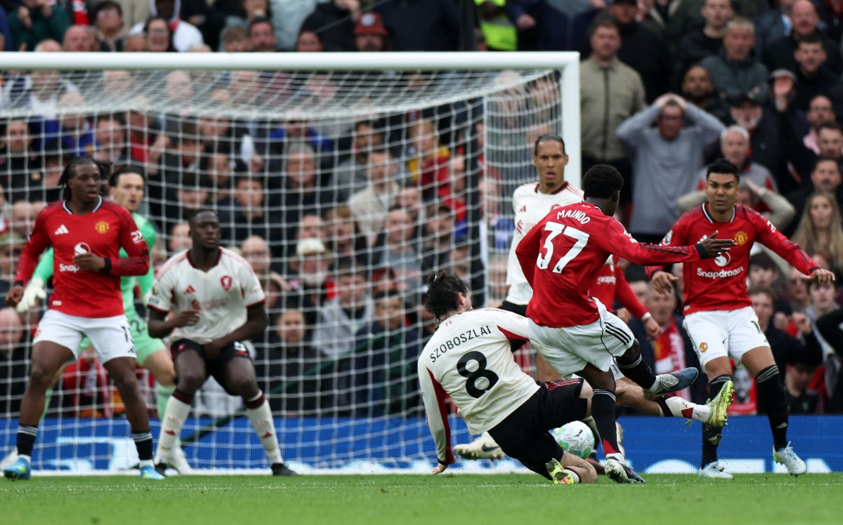 Manchester United's English midfielder #37 Kobbie Mainoo scores the team's third goal during the English Premier League football match between Manchester United and Liverpool at Old Trafford in Manchester, north west England, on May 3, 2026. (Photo by Darren Staples / AFP)