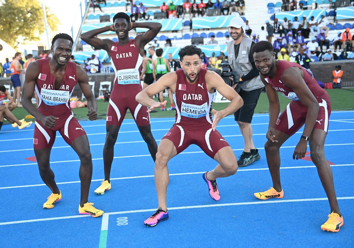 From left: Qatar's Ammar Ismail, Youssef Abdulaziz, Bassem Hmeida and Ashraf Othman celebrate after qualifying for the World Athletics Championships. (AFP)