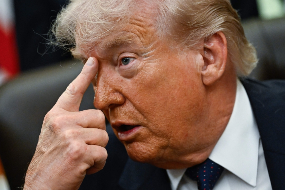 US President Donald Trump gestures as he speaks in the Oval Office of the White House in Washington, DC on May 5, 2026. (Photo by Kent Nishimura / AFP)
