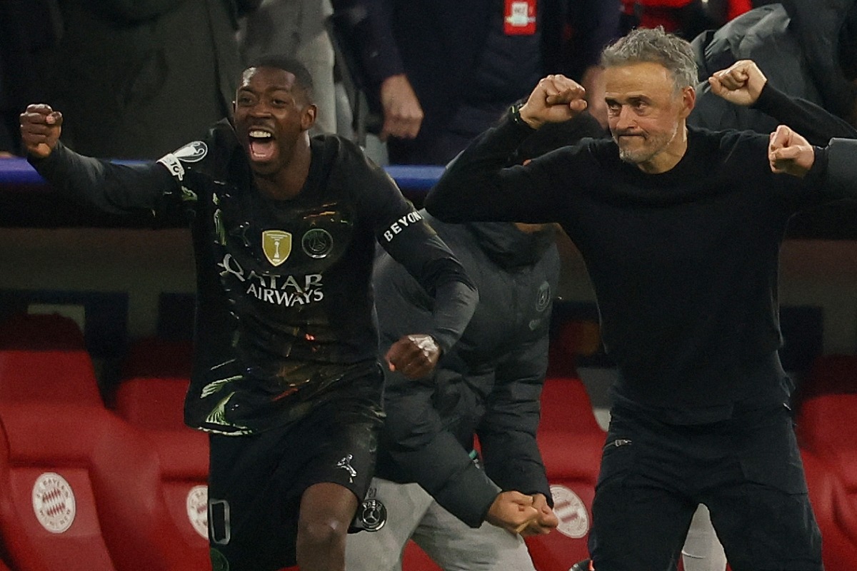 Paris Saint-Germain's Spanish head coach Luis Enrique (R) and his players including Paris Saint-Germain's French forward #10 Ousmane Dembele (L) celebrate after the UEFA Champions League second-leg, semi-final football match between FC Bayern Munich and Paris Saint-Germain (PSG) in Munich, southern Germany on May 6, 2026. (Photo by Odd ANDERSEN / AFP)