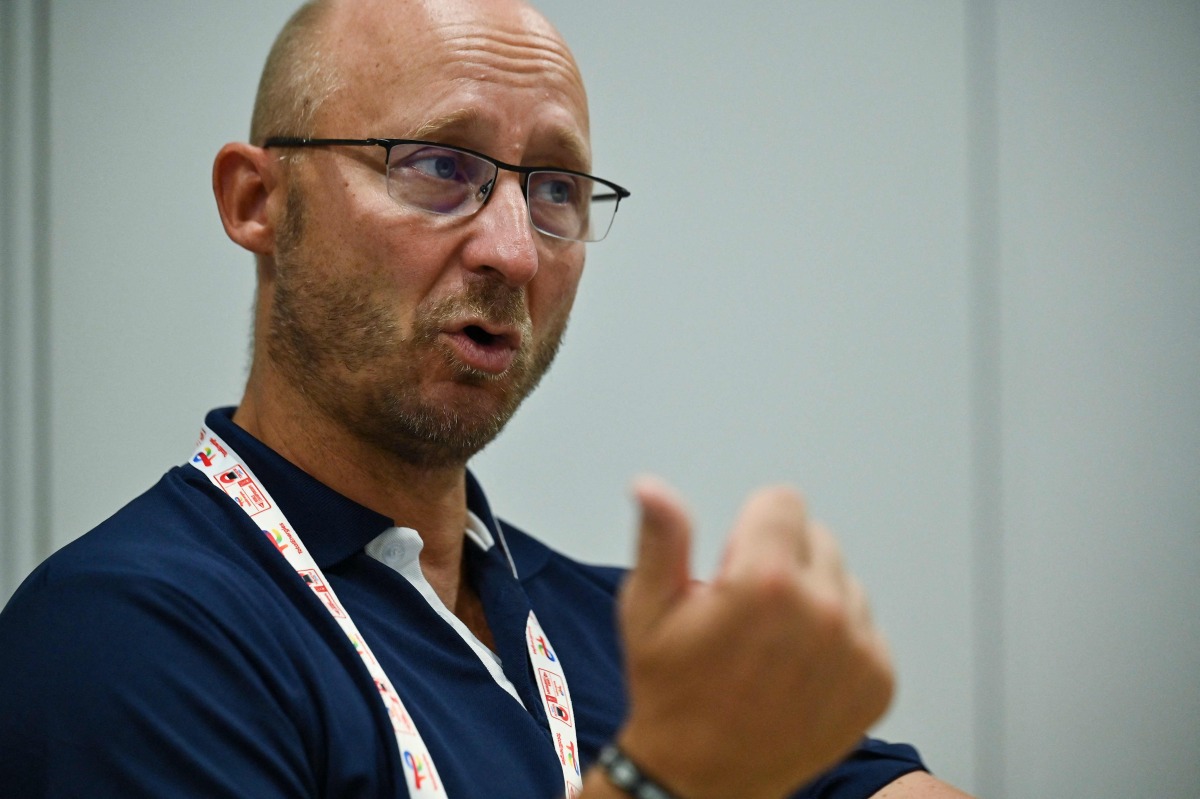 This photo taken on August 23, 2022 shows Badminton World Federation (BWF) secretary general Thomas Lund of Denmark speaking during an interview with AFP on the sidelines of the Badminton World Championships in Tokyo. Photo by Richard A. Brooks / AFP