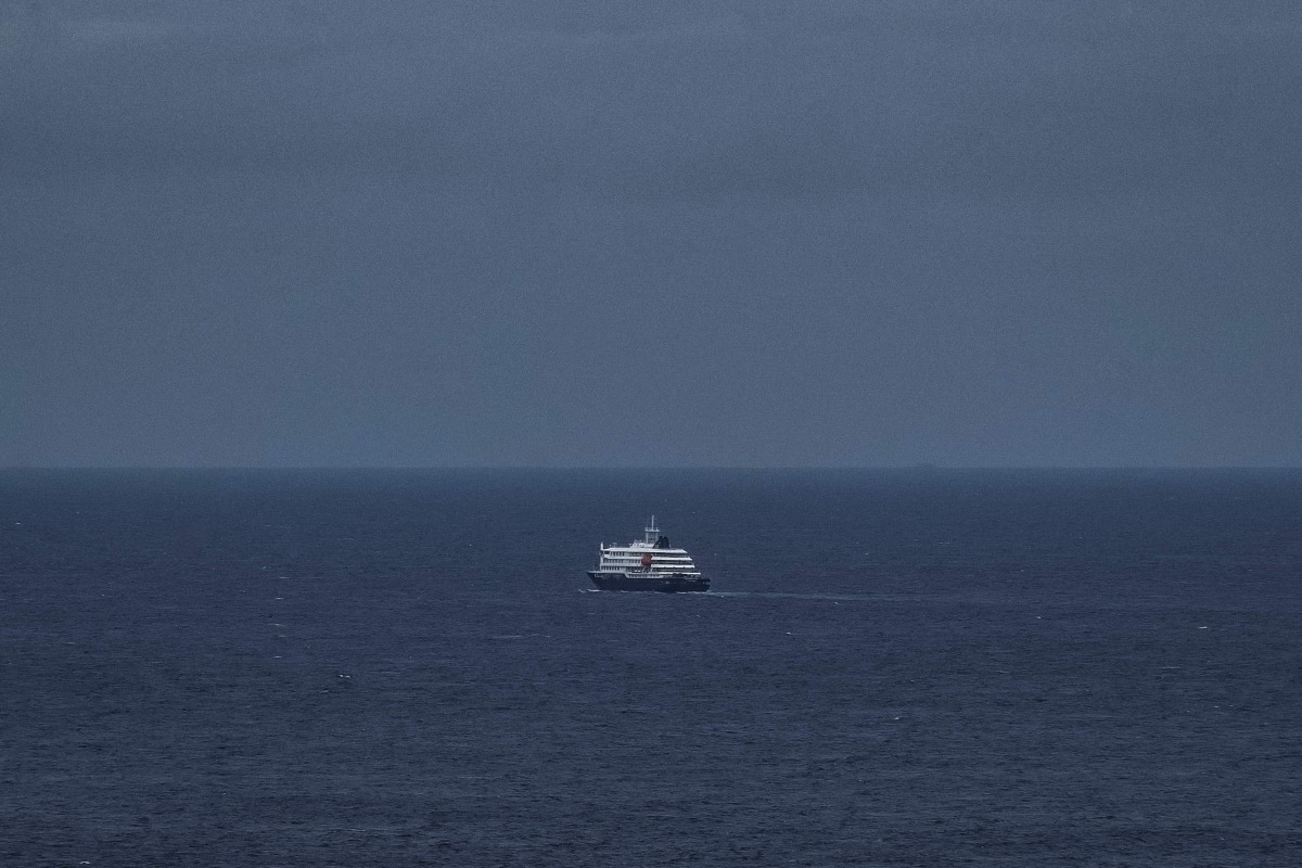 This general view shows the cruise ship MV Hondius, leaving the port of Praia, the capital of Cape Verde, on May 6, 2026. Photo by AFP