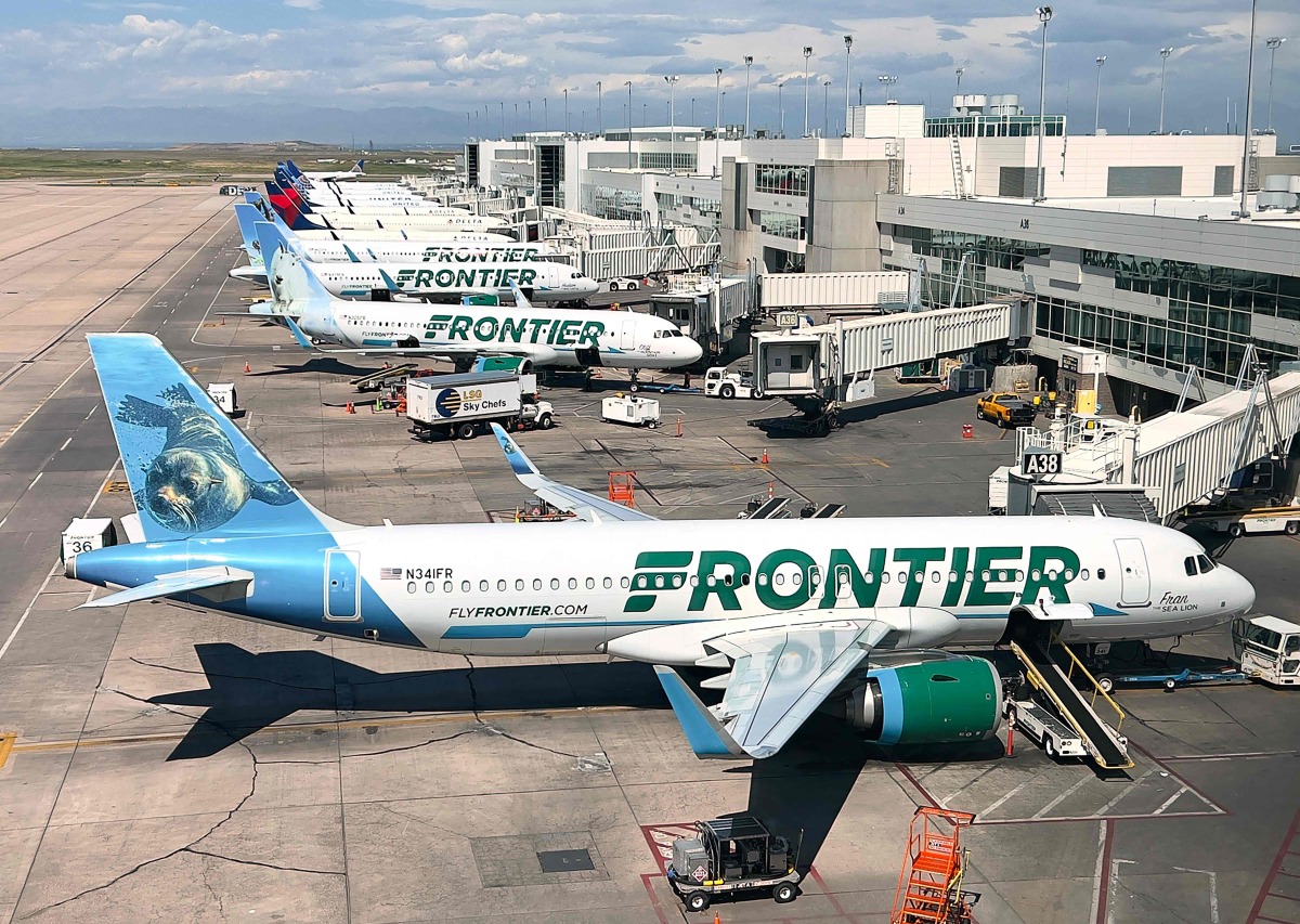 (FILES) Frontier Airlines planes are parked at gates in Denver International Airport (DEN) in Denver, Colorado, on August 5, 2023. (Photo by Daniel SLIM / AFP)
