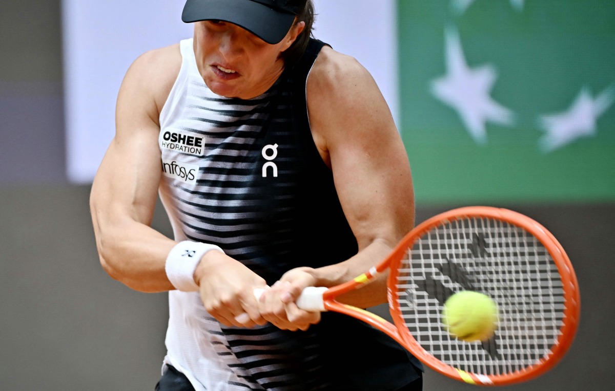Poland's Iga Swiatek hits a return to USA's Jessica Pegula during the ATP Rome Open tennis tournament at Foro Italico in Rome on May 13, 2026. (Photo by Filippo MONTEFORTE / AFP)
