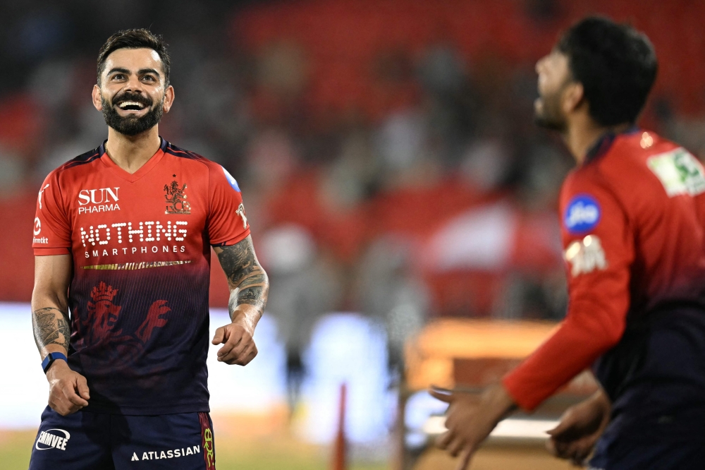Royal Challengers Bengaluru's Indian cricket player Virat Kohli gestures as he practices before the start of the 2026 Indian Premier League (IPL) T20 match between Royal Challengers Bengaluru and Kolkata Knight Riders at the Shaheed Veer Narayan Singh International Stadium in Raipur on May 13, 2026. (Photo by Noah Seelam / AFP)