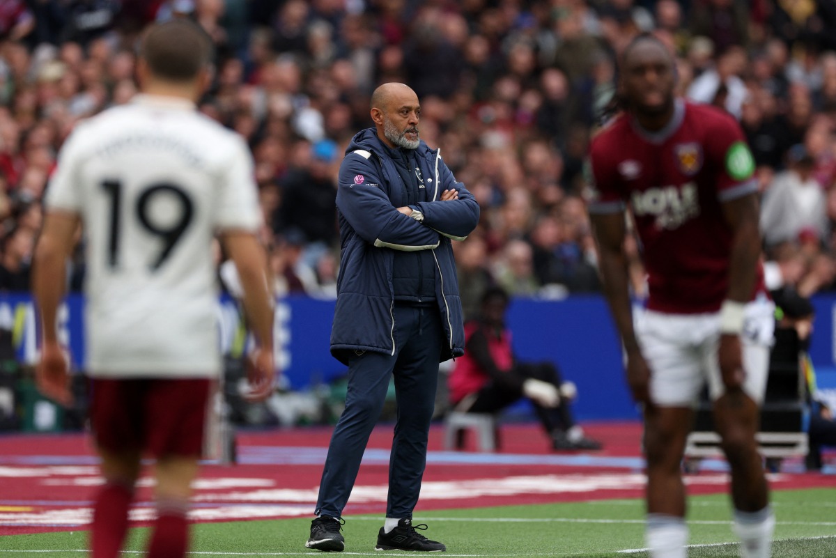 West Ham United's Portuguese head coach Nuno Espírito watches the players from the touchline Santo during the English Premier League football match between West Ham United and Arsenal at the London Stadium, in east London on May 10, 2026. (Photo by Adrian Dennis / AFP)
