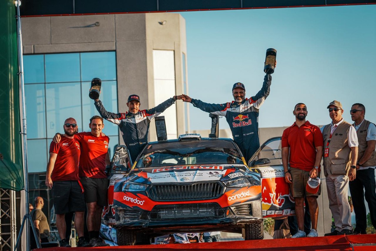 Qatar's Nasser Saleh Al-Attiyah and his Spanish navigator Candido Carrera celebrate with the support crew after winning the 2026 Jordan Rally.