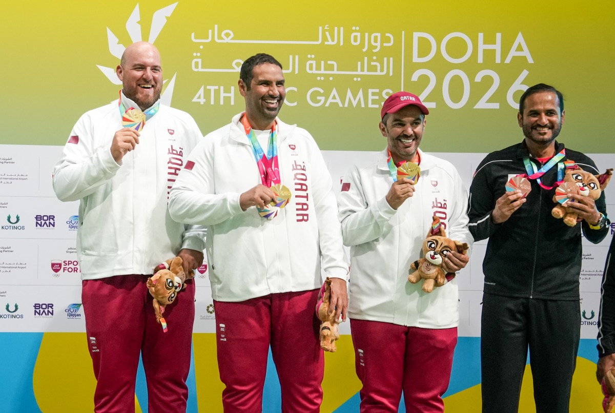Qatar's Angelo Scalzoni, Mohammed Al Rumaihi and Saeed Abu Shareb celebrate with their gold medals.