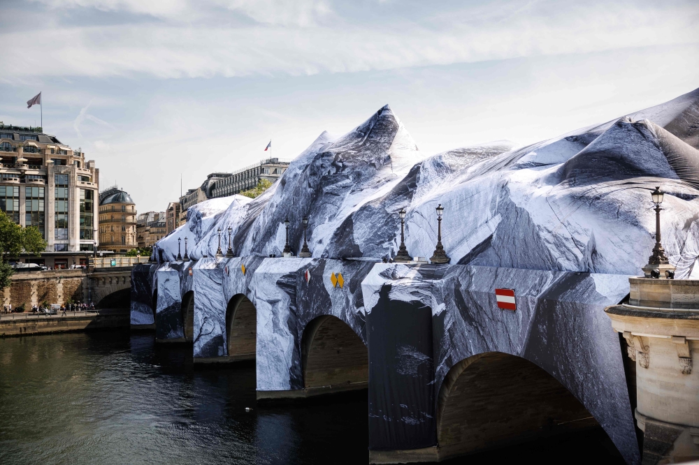 This photograph taken at the Pont-Neuf bridge in Paris on May 21, 2026 shows the installation of 