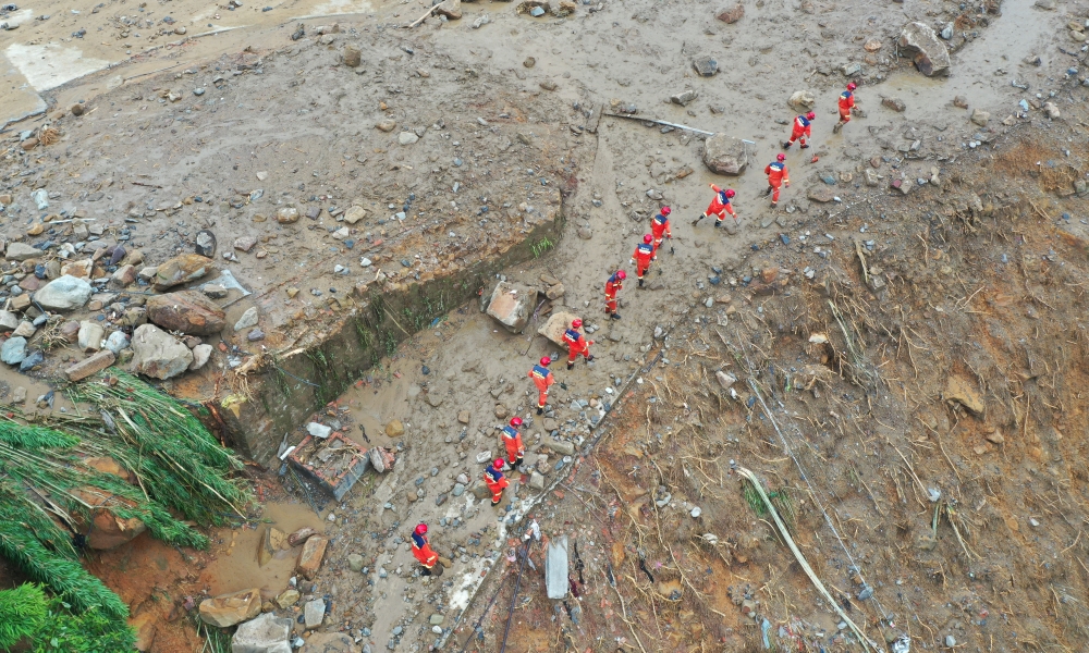 An aerial drone photo taken on May 24, 2026 shows rescuers working on site after a heavy rainstorm hit Yongchuan District in southwest China's Chongqing Municipality. (Xinhua/Wang Quanchao)
