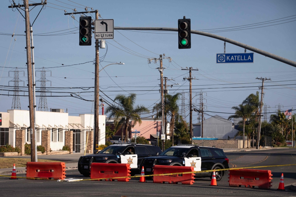 Orange County sheriff deputies block Western Avenue at Katella Avenue as roads remain closed after a chemical leak in Garden Grove, California, on May 24, 2026. (Photo by Blake Fagan / AFP)