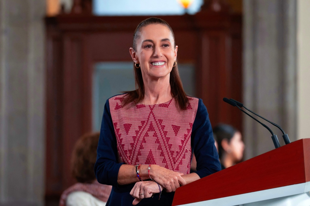 Handout photo released by Mexico's Presidency press office shows Mexico's President Claudia Sheinbaum during her daily press conference at the National Palace in Mexico City on May 25, 2026. (Photo by Saul lopez Escorcia / Presidencia de Mexico / AFP) 