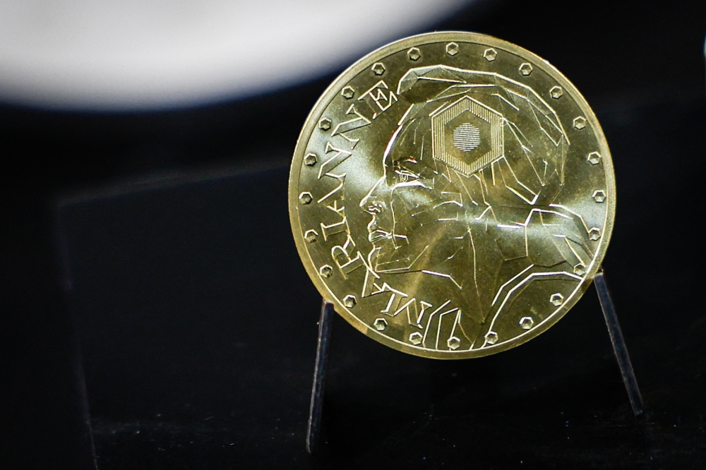 This photograph shows a Marianne-Or gold coin bullion displayed at La Monnaie de Paris in Paris on May 21, 2026. (Photo by Simon Wohlfahrt / AFP)