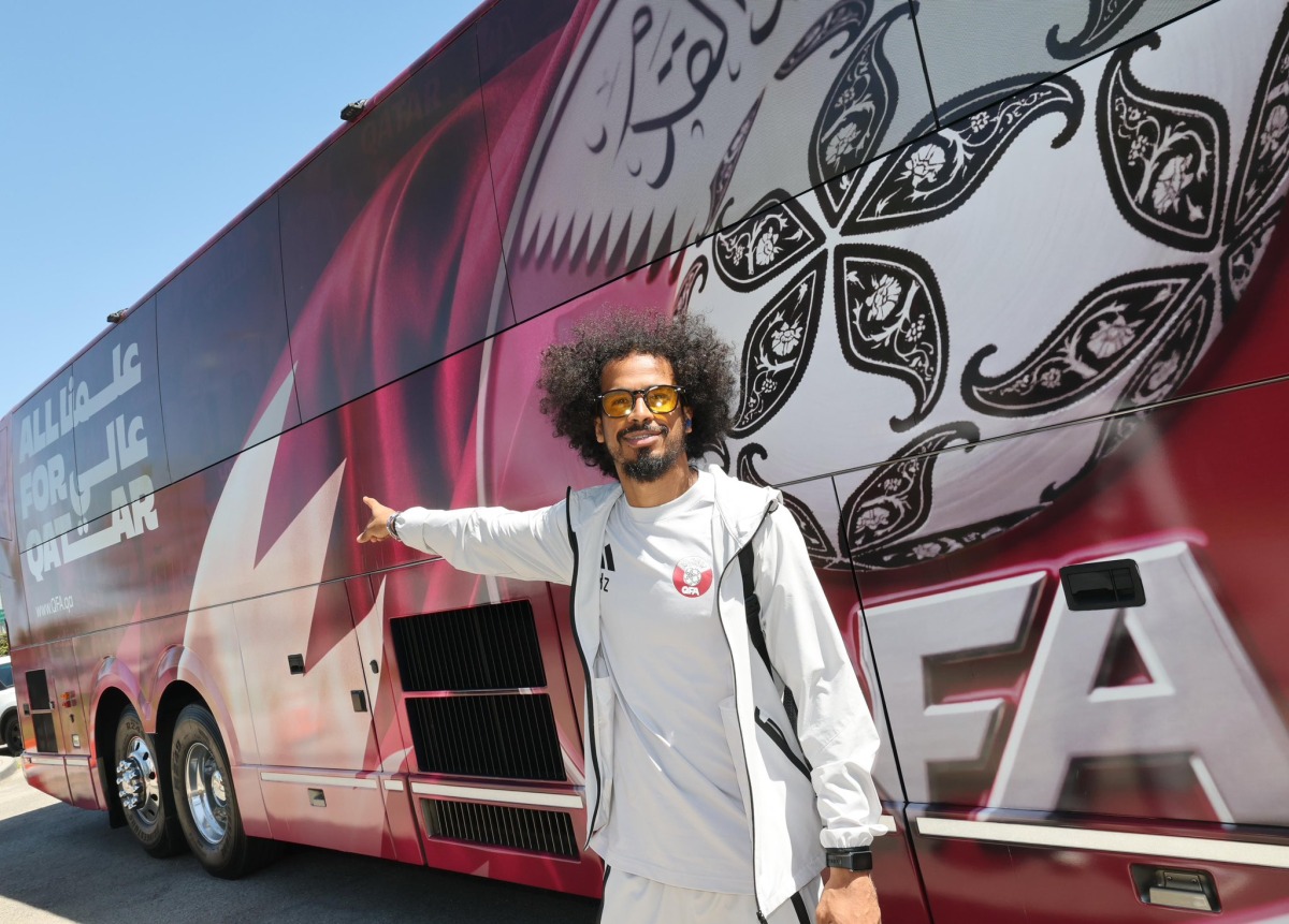 Qatar's Akram Afif stands next to the team bus upon Al Annabi's arrival in Santa Barbara.