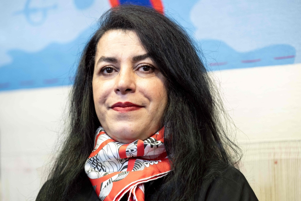 (Files) French-Iranian graphic novelist and illustrator Marjane Satrapi during the unveiling of an Olympic triptych tapestry created for the Paris 2024 Olympic Games on March 12, 2024. (Photo by Bertrand Guay / AFP)
 