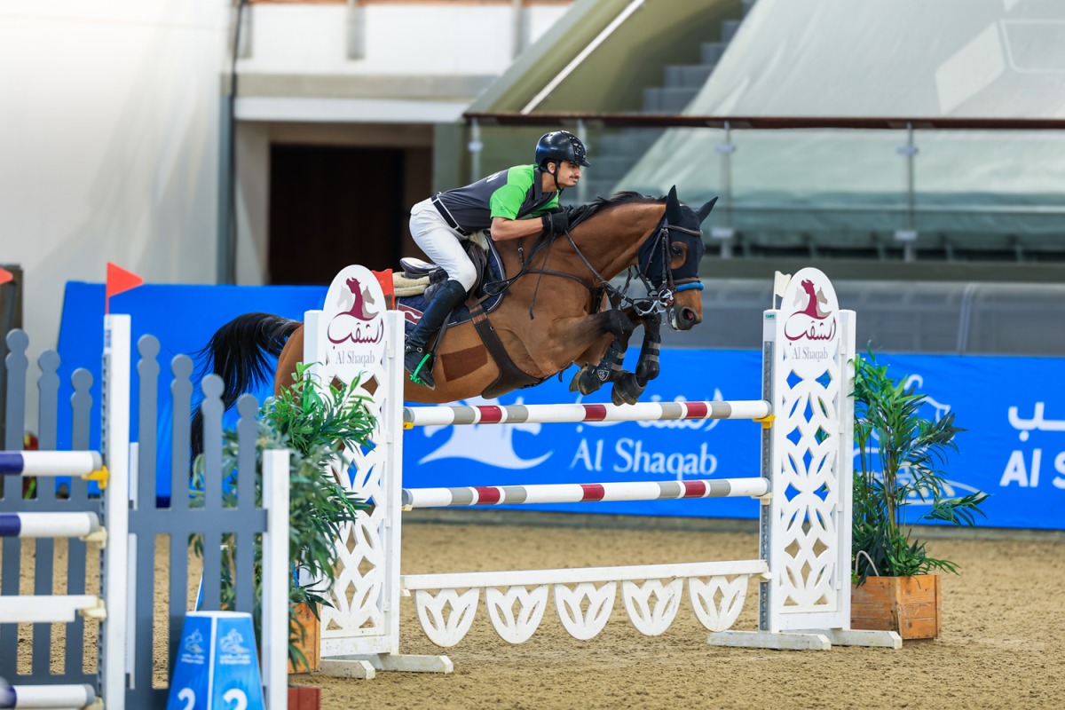 Saudi Arabia’s Khaled Al Hadi guides Capoen during the Youth Champions class event. 