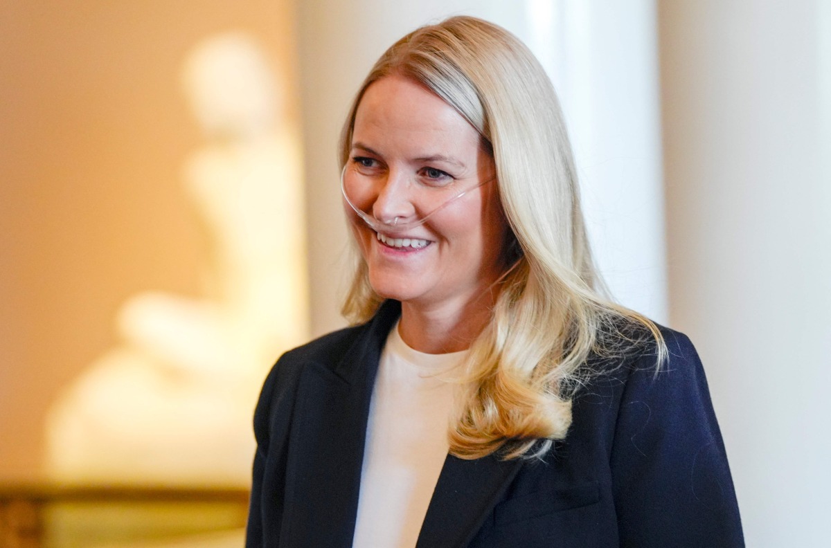 Crown Princess Mette-Marit of Norway smiles as she arrives for a reception of the Norwegian athletes who took part in the Paralympics in Milano Cortina 2026, at the Royal Palace in Oslo, Norway, on April 10, 2026. Photo by Lise إserud / NTB / AFP