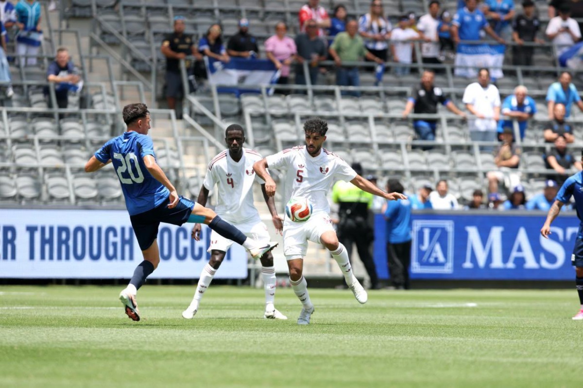 Qatar's Jassim Jaber (right) controls the ball during the match.