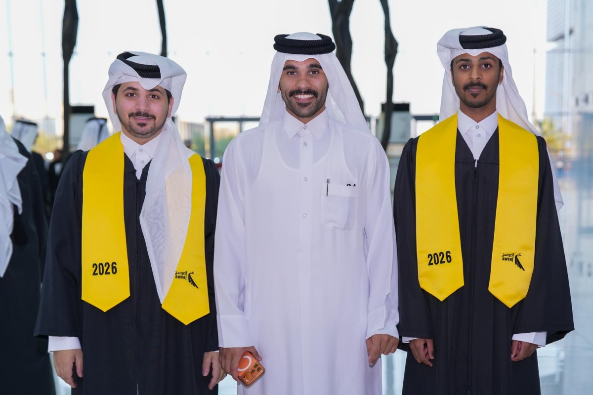 Graduating students and an official during the ceremony.