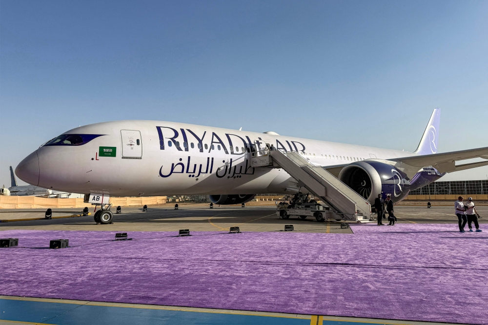 A Boeing 787-9 Dreamliner aircraft of Saudi airline Riyadh Air is pictured on the tarmac at King Khalid International Airport in Riyadh (Photo by Sofiane Alsaar/ AFP)