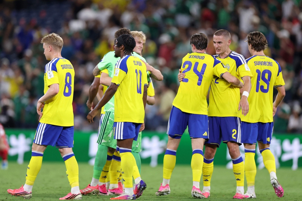 Sweden's players celebrate after winning the 2026 World Cup Group F football match between Sweden and Tunisia at the Monterrey Stadium in Guadalupe on June 14, 2026. (Photo by Julio Cesar Aguilar / AFP)
