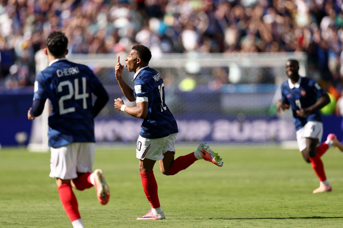 France's forward #10 Kylian Mbappe celebrates after scoring his team's third goal during the 2026 World Cup Group I football match between France and Senegal at the New York/New Jersey Stadium in East Rutherford on June 16, 2026. (Photo by CHARLY TRIBALLEAU / AFP)
