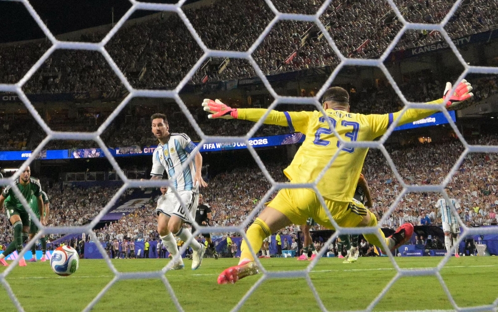 Argentina's forward #10 Lionel Messi shoots and scores his team's second goal during the 2026 World Cup Group J football match in Kansas City on June 16, 2026. (Photo by Juan Mabromata / AFP)

