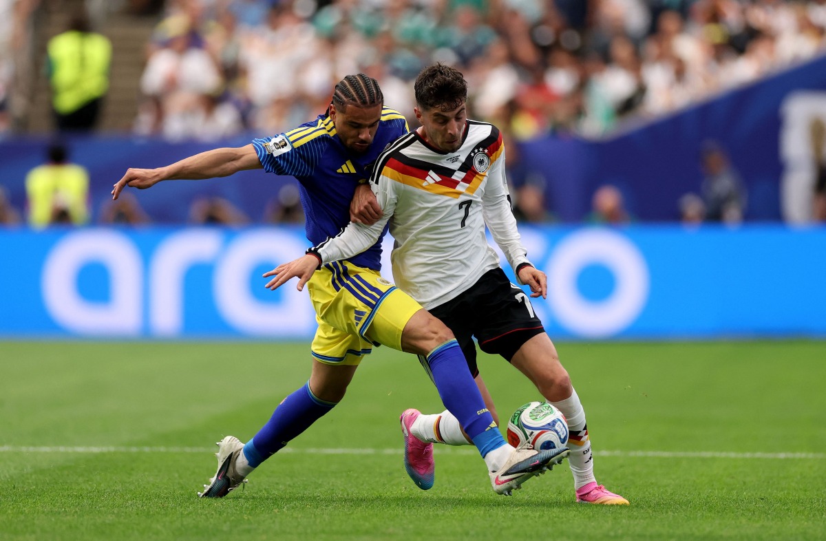 Armando Obispo #18 of Curacao challenges Kai Havertz #7 of Germany during the FIFA World Cup 2026 Group E match between Germany and Curacao at Houston Stadium on June 14, 2026 in Houston, Texas. Lars Baron/Getty Images/AFP 