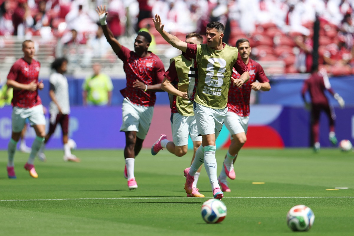 Granit Xhaka (second right) of Switzerland and his teammates wave to fans.
