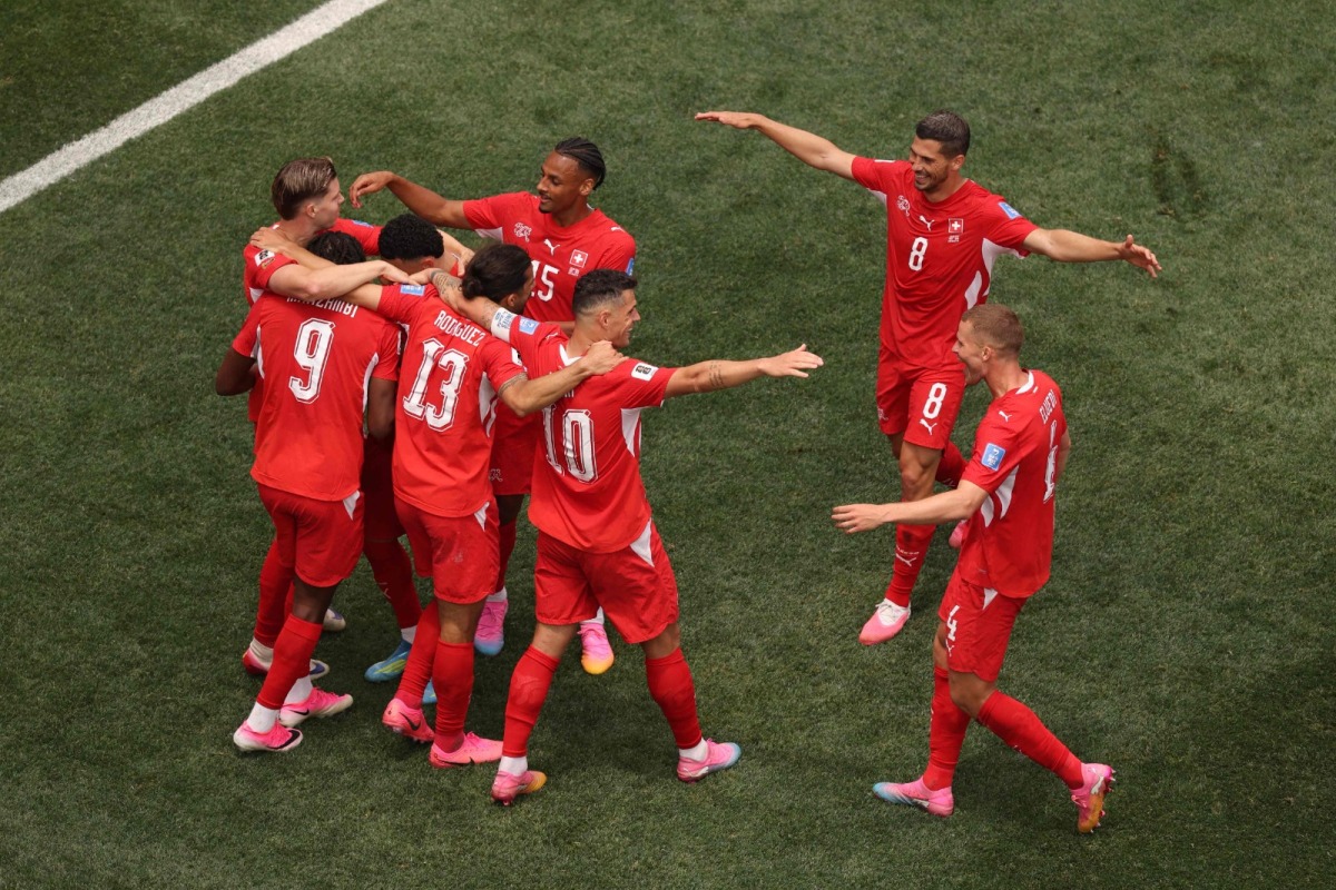 Johan Manzambi #9 of Switzerland celebrates with teammates after scoring the team's third goal during the FIFA World Cup 2026 Group B match between Switzerland and Bosnia and Herzegovina at Los Angeles Stadium on June 18, 2026 in Inglewood, California.