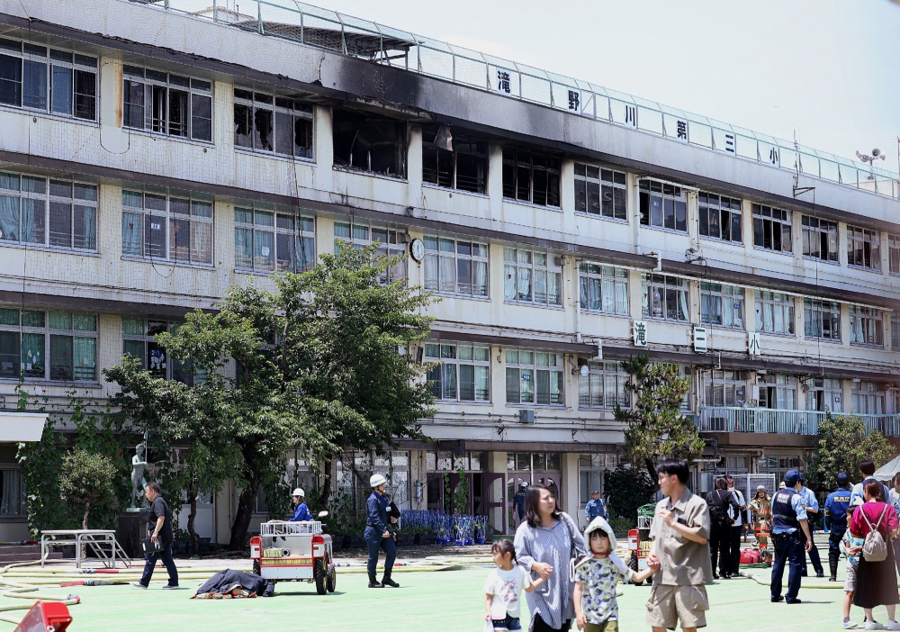 This photo shows Takinogawa Dai-san Elementary School, where a fire broke out on the fourth floor of the school building in Tokyo (Photo by Jiji Press / AFP) / Japan OUT