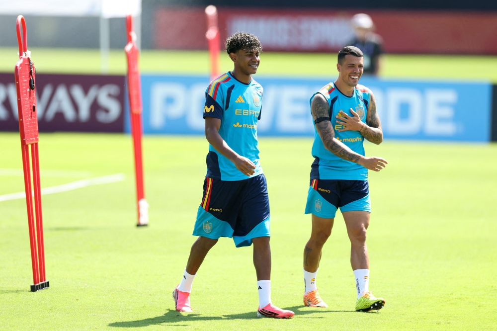Lamine Yamal #19 and Pedro Porro #12 of Spain interact during the training at Baylor School on June 19, 2026 in Chattanooga, Tennessee. Florencia Tan Jun/Getty Images/AFP