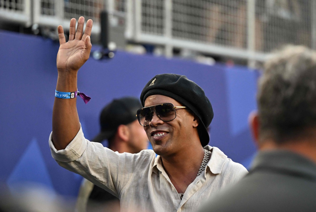 Brazilian former football star Ronaldinho waves ahead of the 2026 World Cup Group C football match between Brazil and Haiti at the Philadelphia Stadium in Philadelphia on June 19, 2026. (Photo by Jewel SAMAD / AFP)