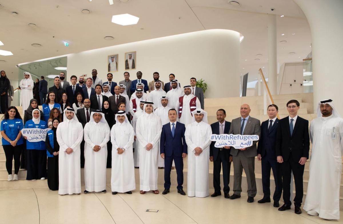 Chairman of the Board of Directors of Qatar Fund for Development H E Sheikh Thani bin Hamad Al Thani, and other officials and participants during the event.