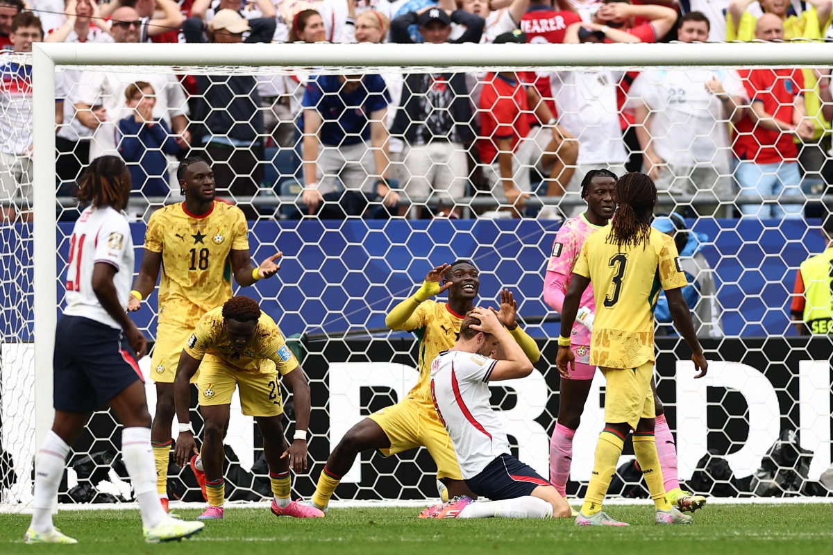 England's forward #09 Harry Kane (C) reacts after missing a goal opportunity during the 2026 World Cup Group L football match between England and Ghana at the Boston Stadium in Foxborough on June 23, 2026. (Photo by CHARLY TRIBALLEAU / AFP)