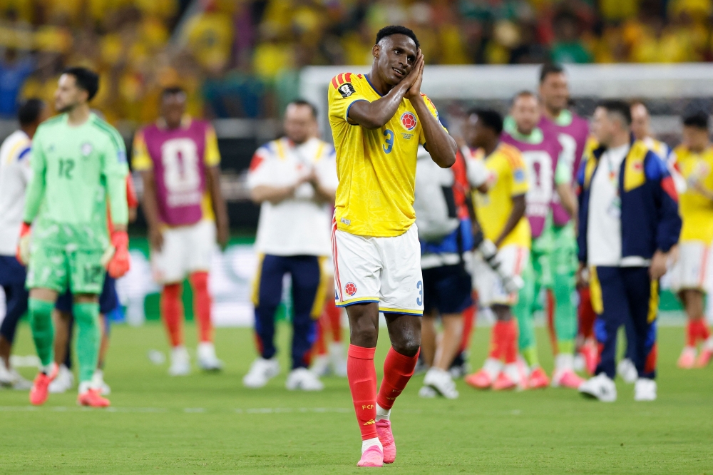 Colombia's defender #03 Jhon Lucumi celebrates after winning the 2026 World Cup Group K football match between Colombia and Democratic Republic of Congo. (Photo by Ulises Ruiz / AFP)