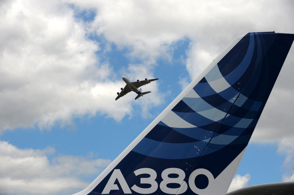 (FILES) An Airbus A380 performs a flying display at Le Bourget airport, near Paris, on June 24, 2017 during the public days the International Paris Air Show. (Photo by Eric Piermont/ AFP)