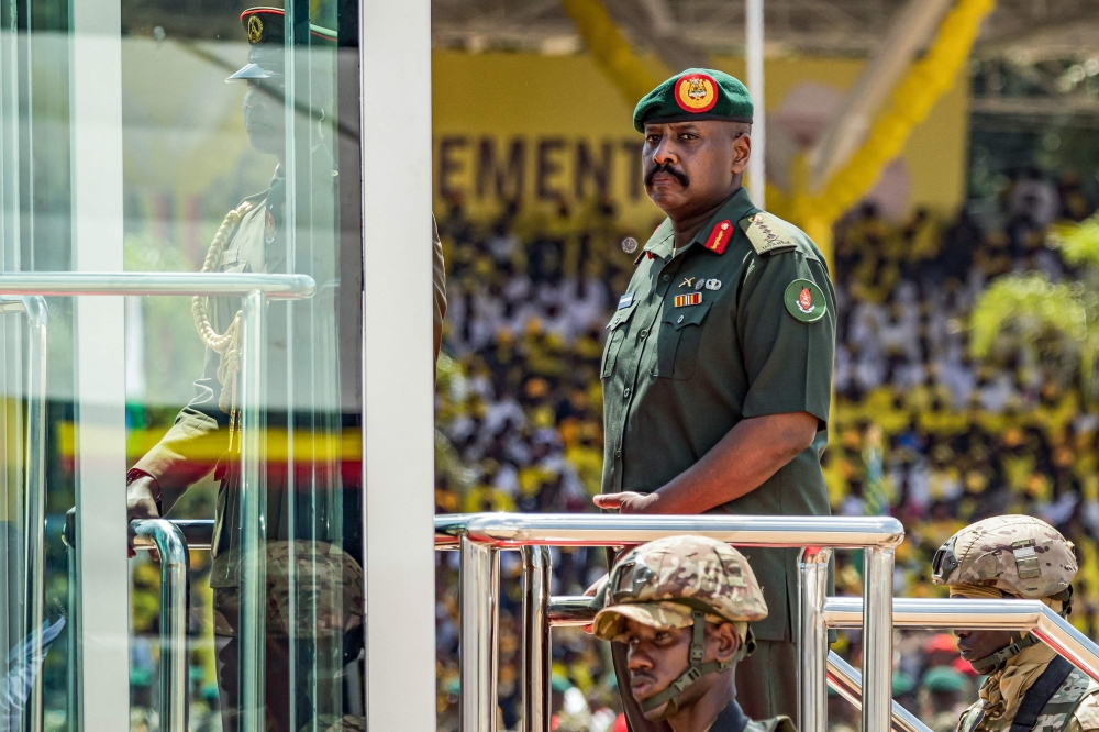 (Files) Muhoozi Kainerugaba (C), son of Yoweri Museveni and Uganda's Chief of Defence Forces, inspects a military parade on May 12, 2026. (Photo by Badru Katumba / AFP)