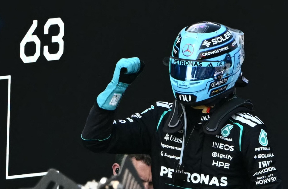 Mercedes' British driver George Russell celebrates after winning the Formula One Austrian Grand Prix at the Red Bull Ring race track in Spielberg, Austria on June 28, 2026. (Photo by Joe Klamar / AFP)