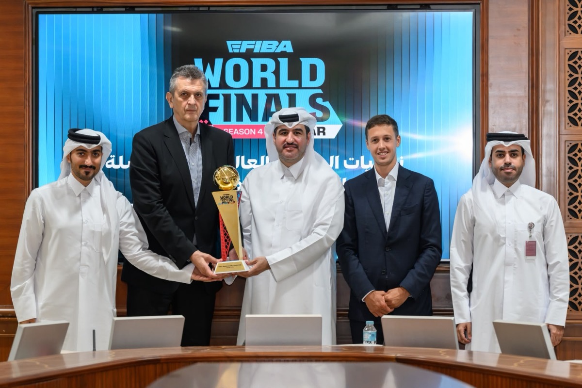 Officials pose with the eFIBA World Finals Season 4 trophy during a press conference in Doha, yesterday.