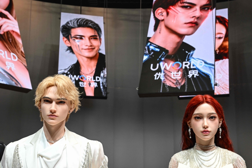 Humanoid robots are displayed during the launch of the U1 humanoid robot produced by UWORLD, a brand under UBTECH Robotics on June 30, 2026. (Photo by Adek Berry / AFP)