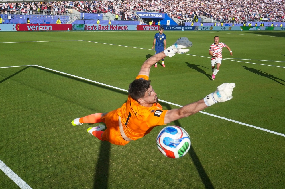 Nikola Vasilj #1 of Bosnia and Herzegovina fails to save a freekick from Malik Tillman #17 of the United States on July 01, 2026 in Santa Clara, California. Charlotte Wilson/Getty Images/AFP