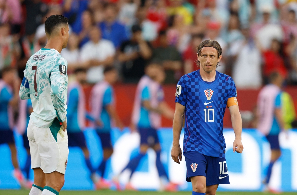 Croatia's midfielder #10 Luka Modric reacts next to Portugal's forward #07 Cristiano Ronaldo on July 2, 2026. (Photo by Kamil Krzaczynski / AFP)