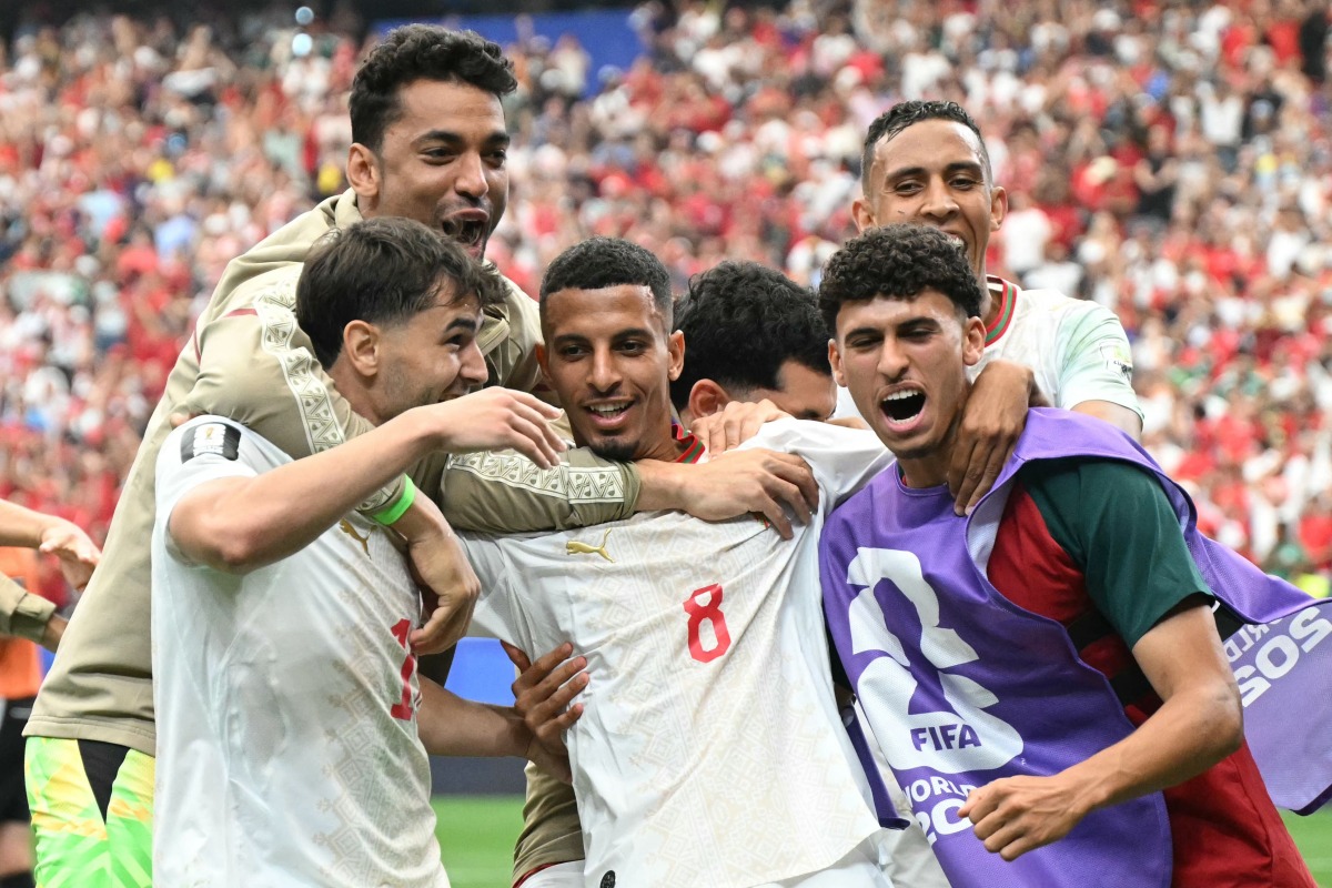 Morocco's midfielder #08 Azzedine Ounahi celebrates scoring his team's second goal with teammates during the 2026 World Cup round of 16 football match between Canada and Morocco at the Houston Stadium in Houston on July 4, 2026. (Photo by RONALDO SCHEMIDT / AFP)