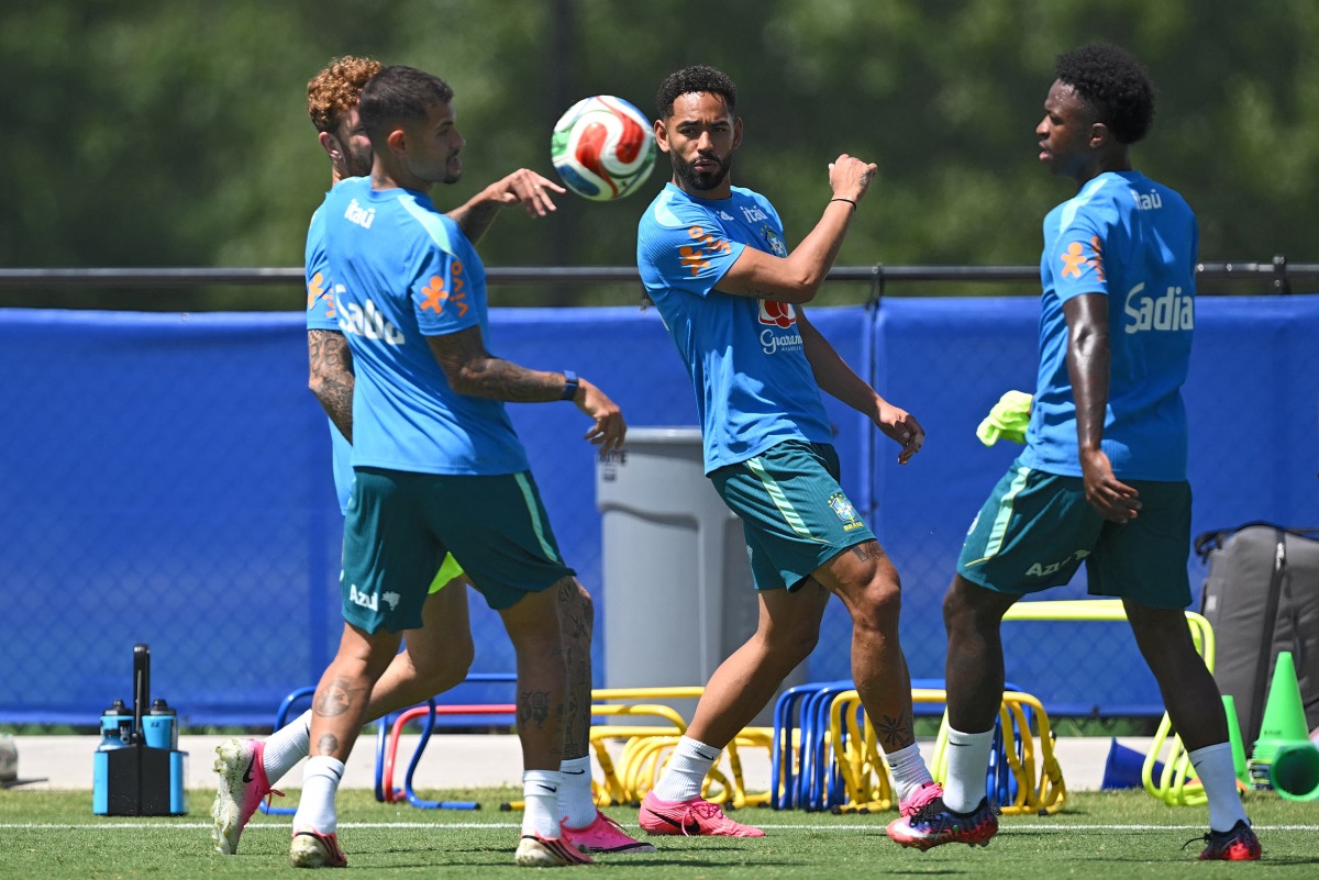 Brazil’s Matheus Cunha (centre) and Vinicius Junior (right) take part in a training session with teammates. (PICS AFP)