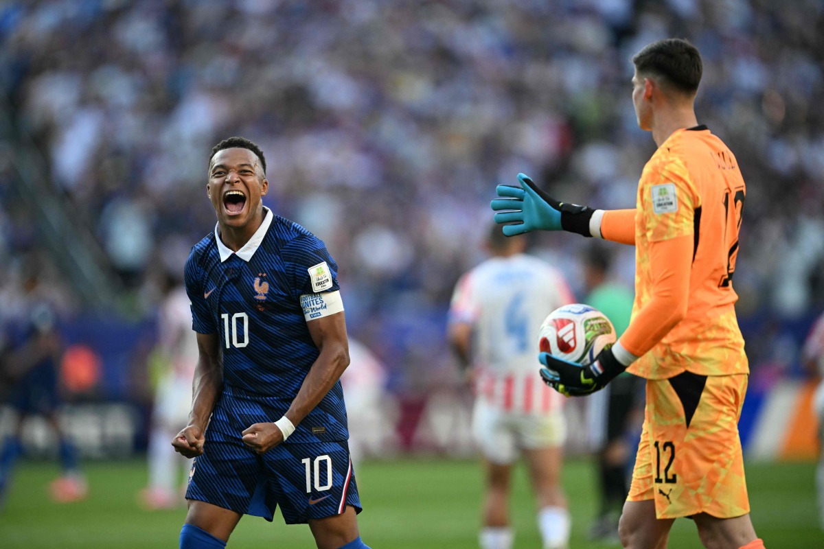 France's forward #10 Kylian Mbappe celebrates past Paraguay's goalkeeper #12 Orlando Gill after winning the 2026 World Cup round of 16 football match between Paraguay and France at the Philadelphia Stadium in Philadelphia on July 4, 2026. (Photo by MAURO PIMENTEL / AFP)