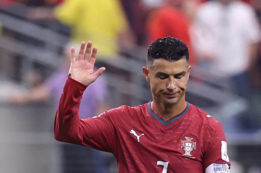 Portugal's forward #07 Cristiano Ronaldo waves to fans after losing the 2026 World Cup round of 16 football match between Portugal and Spain at the Dallas Stadium in Arlington on July 6, 2026. (Photo by Thomas Coex / AFP)