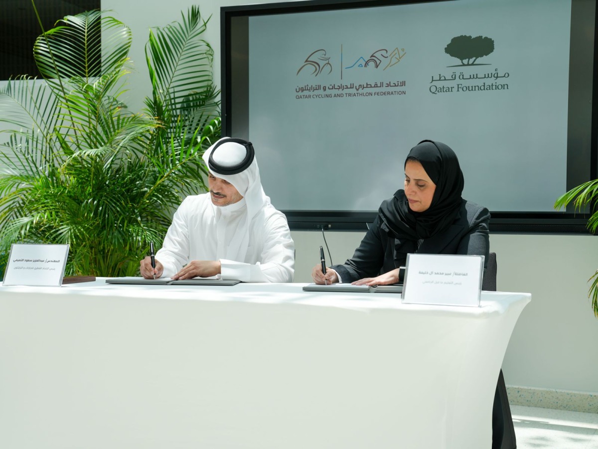 President of Pre-University Education at Qatar Foundation Abeer Al Khalifa and President of QCTF Eng Abdulaziz Saud Al Tamimi signing the agreement during the ceremony.
